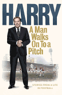 A Man Walks On To a Pitch