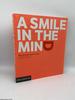 A Smile in the Mind: Witty Thinking in Graphic Design (Revised Ed)
